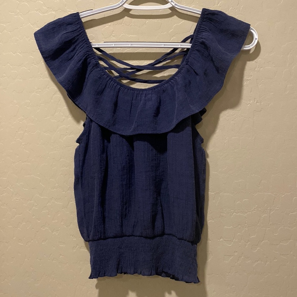 Size small! Cute top with some wear but still cute!